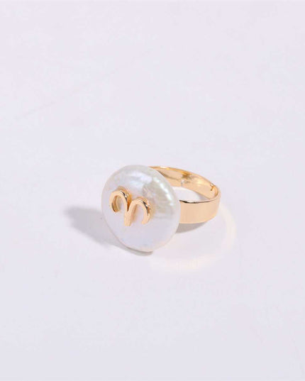 Cosmic Constellation Ring with celestial star sign design on gold band.