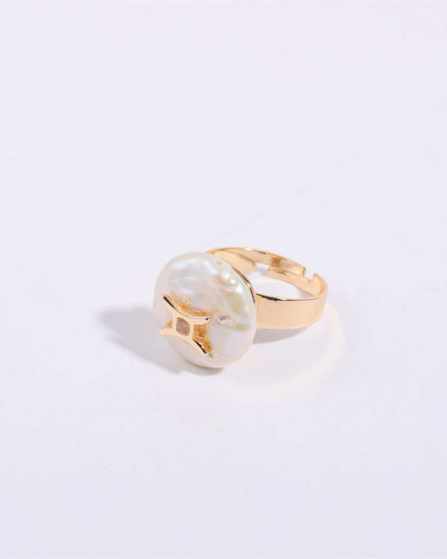 Cosmic Constellation Ring with celestial star sign design on a gold band.