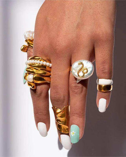 Cosmic Constellation Ring on model's hand, displaying celestial star sign jewelry.