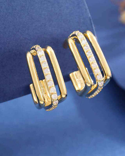 Elegant three-layer square stud earrings with gold finish and unique geometric design.