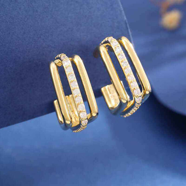 Elegant three-layer square stud earrings with gold finish and unique geometric design.