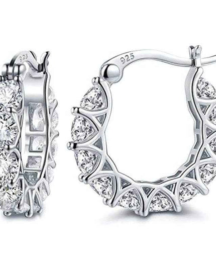 Fashion U-shaped earrings with zircon rhinestones in silver setting.