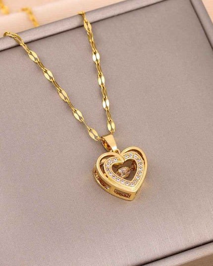 Gold chain with heart-shaped titanium steel pendant on display.