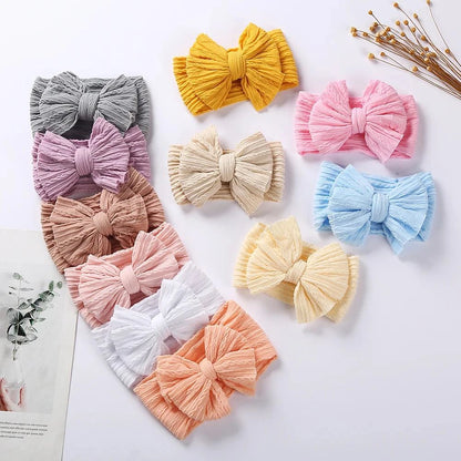 Newborn Solid Cable Baby Bow Headband for ChildEnhance any outfit with our Solid Cable Bow Baby Headband! Stretchy, soft Nylon material won't hurt your baby's head and will grow with them. Available in 20 colors,HairbowsPlush Fashions ShopPlush Fashion ShopNewborn Solid Cable Baby Bow Headband