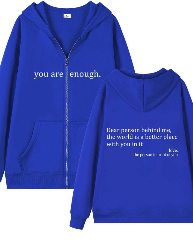 Plus size blue hoodie with white text, drawstring, zipper, and pocket detail.