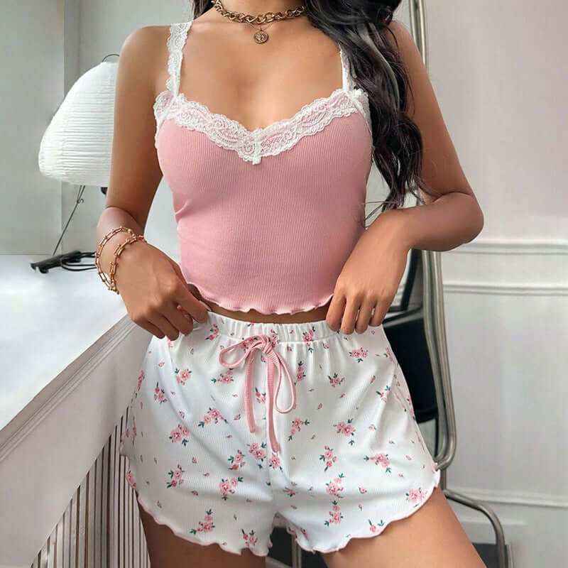 Ladies' homewear lace suspender shorts suit in pink, featuring a sleeveless sling top and floral shorts, perfect for lounging and comfortable wear.