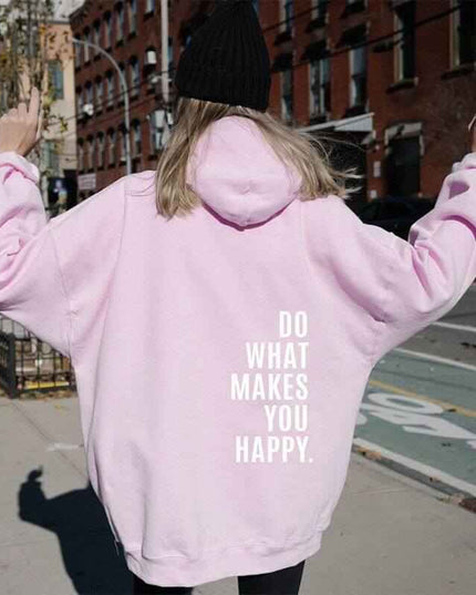 Loose sport hoodie with "Do What Makes You Happy" print in street-style setting.