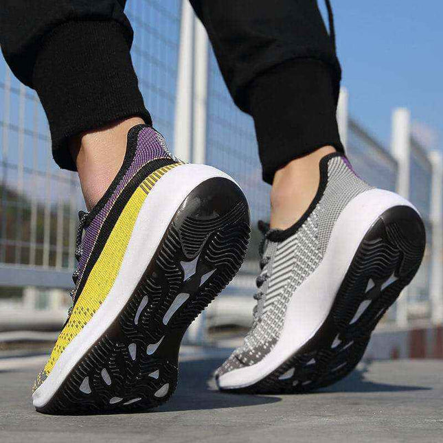 Men's fashion trend casual shoes with breathable flying weave upper and non-slip outsole worn outdoors.