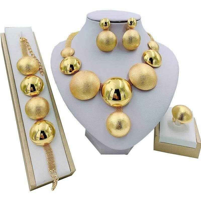 Four-piece alloy jewelry set with necklaces, pendants, earrings, and accessories.