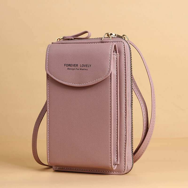 Women mobile phone crossbody large wallet shoulder bag in pink PU leather with synthetic lining.