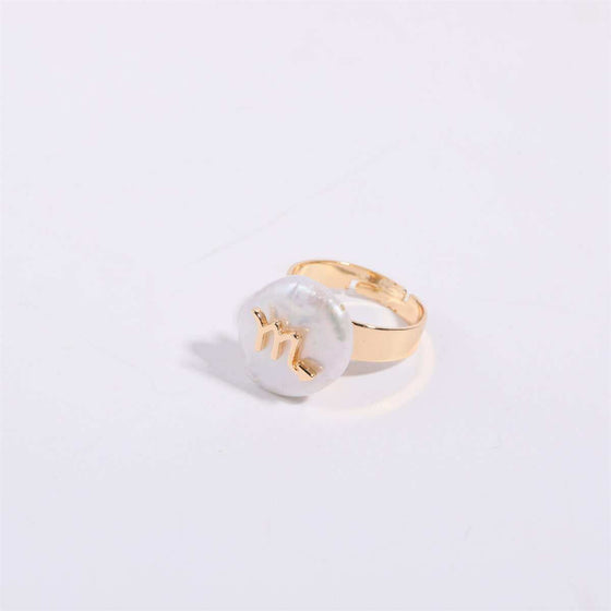 Cosmic Constellation Ring with celestial design on a gold band.