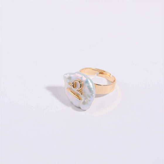 Cosmic Constellation Ring in gold with celestial star sign design.