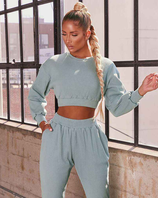 Plush Fashions casual sweat suit in light blue, featuring a fleece sweater and straight pants set for a stylish, comfortable look.