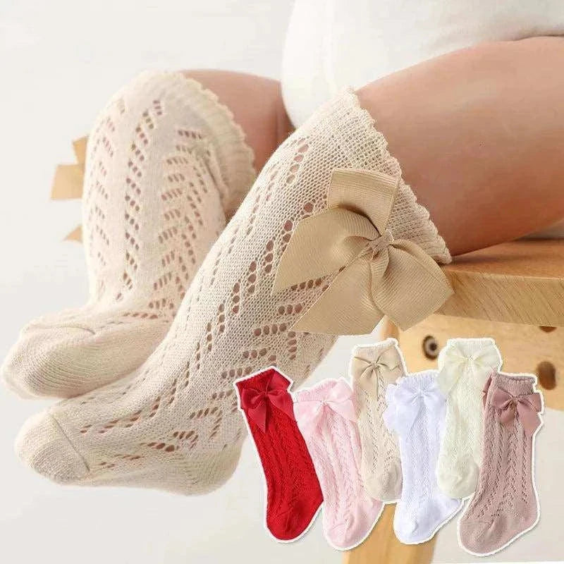 Baby Girls Long Bow Sock with lace detailing, knee-high cotton design, available in multiple colors, for 0-12 months.