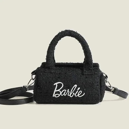 Women Fashion Pillow Barbie Hand Bag in black cylindrical design with embroidered logo.