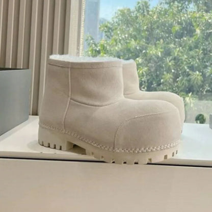 Women’s long tube snow boots with split leather and faux wool lining, featuring a wedge heel and thick design for warmth.