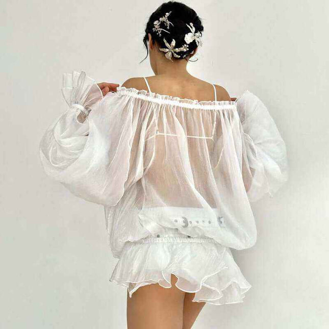 See-through Pure Desire flared sleeves top in white with elegant sheer design.