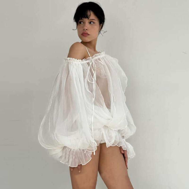 See-through Pure Desire flared sleeves top in white, featuring elegant bell sleeves, perfect for any occasion.