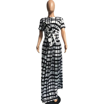 Plaid Two Piece Fashion Tie Up T-shirt and Maxi Skirts Matching Set FoElevate your style with this stunning Plaid Two Piece Matching Set for Women. Featuring a trendy tie-up t-shirt and a flowy maxi skirt, this set will have you channeDressPlush Fashions ShopPlush Fashion Shop