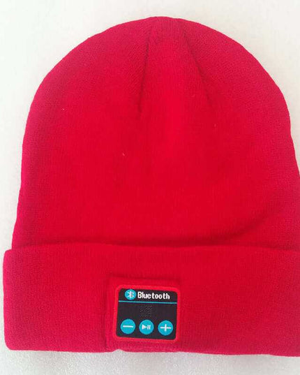 Red wireless knitted headset hat with Bluetooth controls.