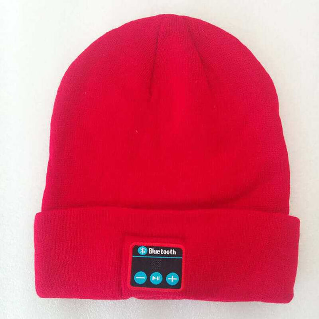 Red wireless knitted headset hat with Bluetooth controls, offering style and seamless music for outdoor use.