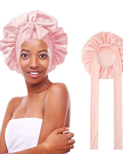 Women's double-layered silk bonnet hair care sleeping hat with elastic tie band in pink.