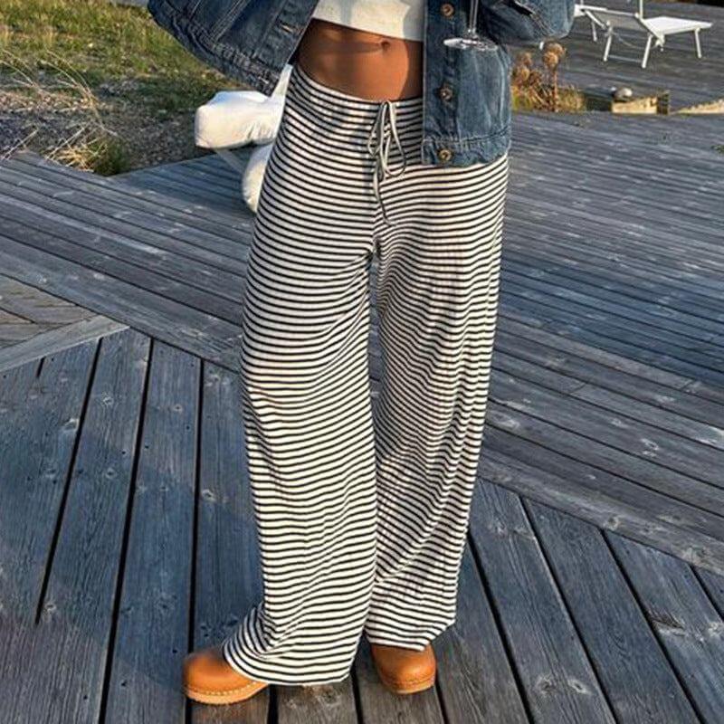 Women's Striped Fashion Casual  Home  Wide-leg PantsElevate your wardrobe with our Women's Striped Print Trousers! Made from high-quality polyester fiber, enjoy a comfortable and stretchy fit with a low waist design. PantsPlush Fashions ShopPlush Fashion Shop