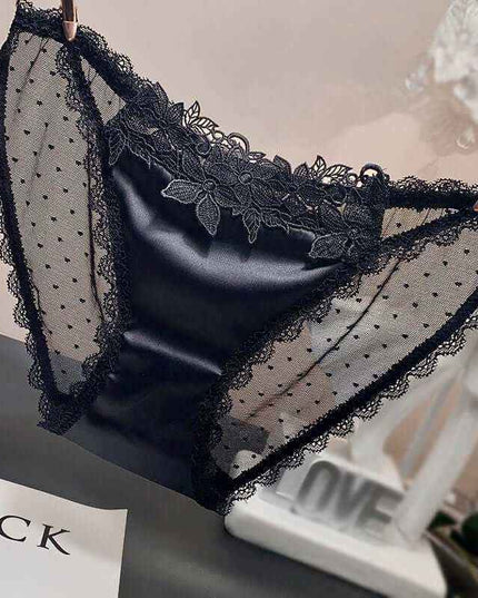 Women's low-waist mesh underwear in black with lace detailing.