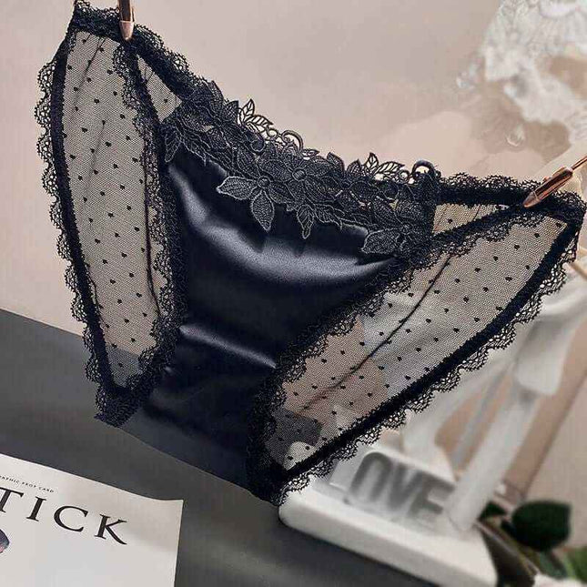 Women's low-waist mesh underwear in black with lace detailing.