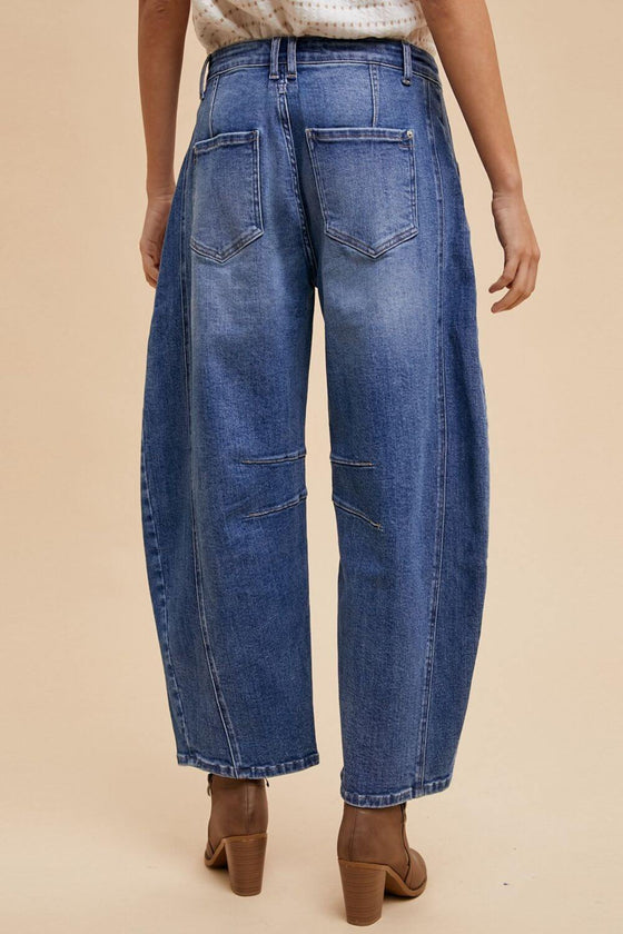 Annie Wear Mid Rise Barrel Leg Jeans with Pockets in blue denim.