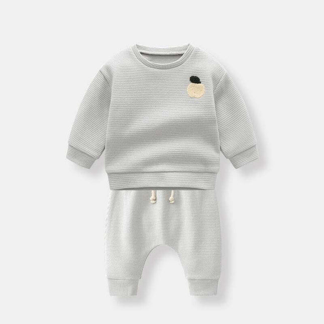 Boys' fashion simple waffle top trousers set in light grey.