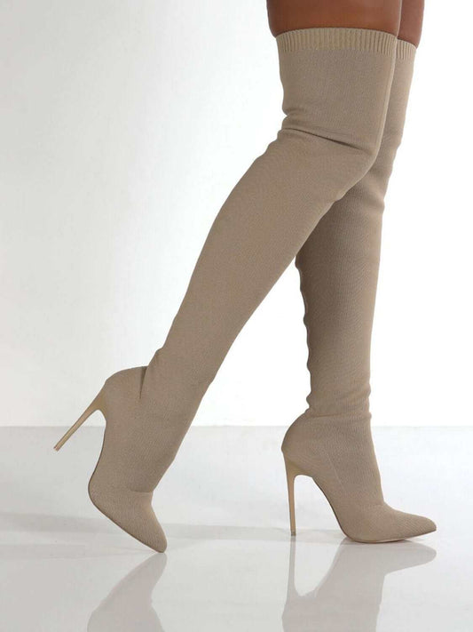 Knee stiletto boots with point toe design in beige, featuring high heels and over-the-knee length.