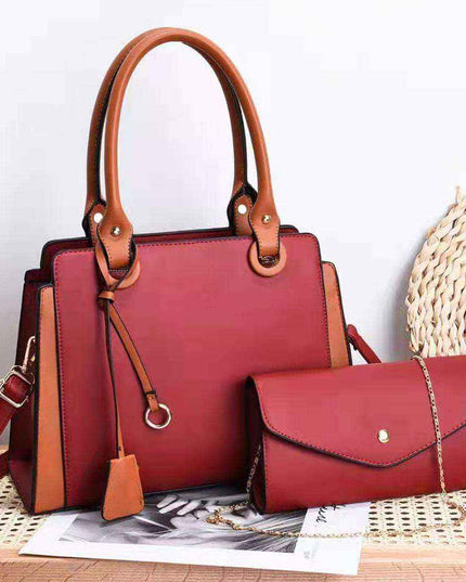 Trendy women's bags in red with matching handles and accented details.