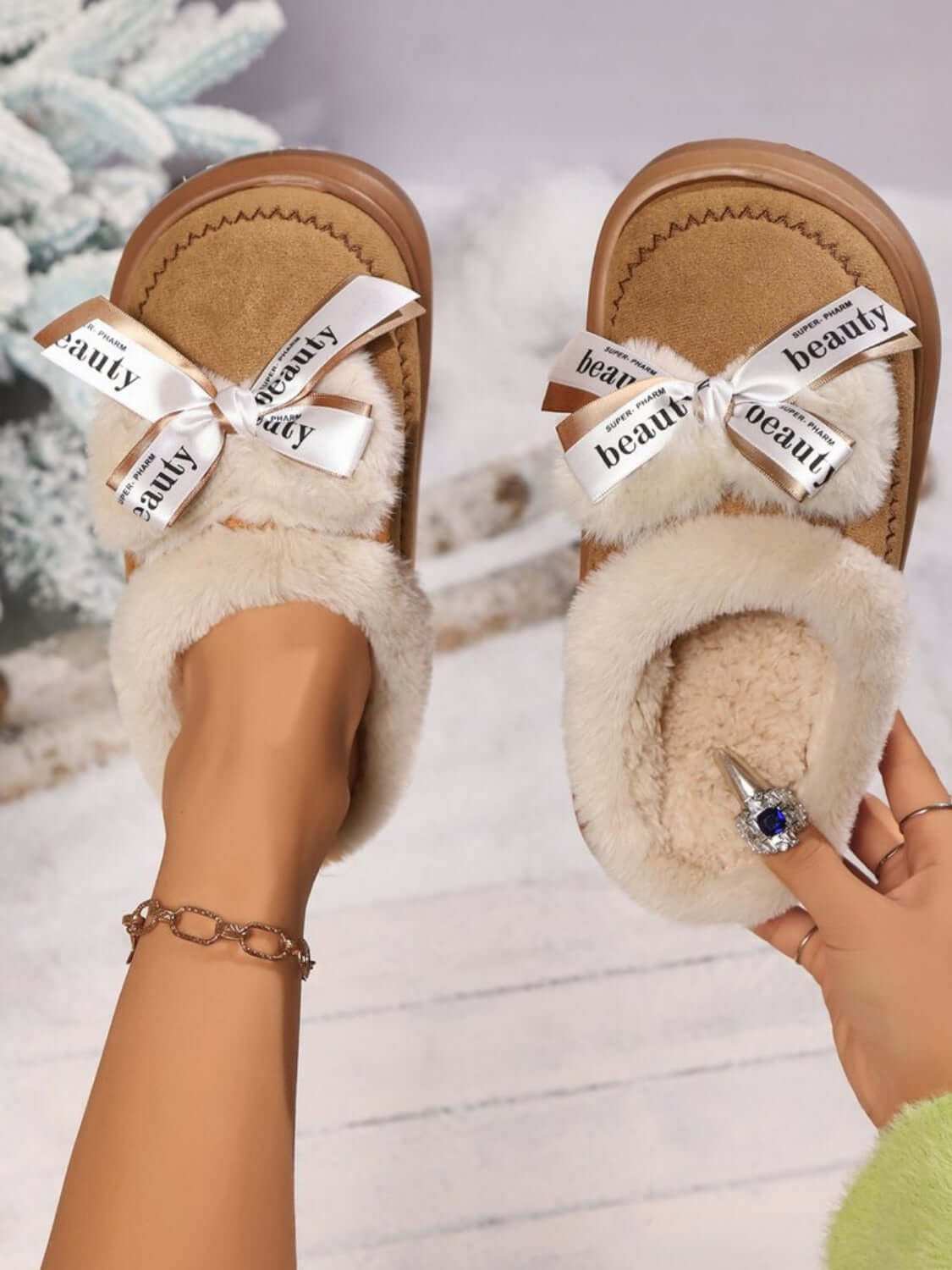 Bow Suede Platform Plush Slippers with elegant bow design.