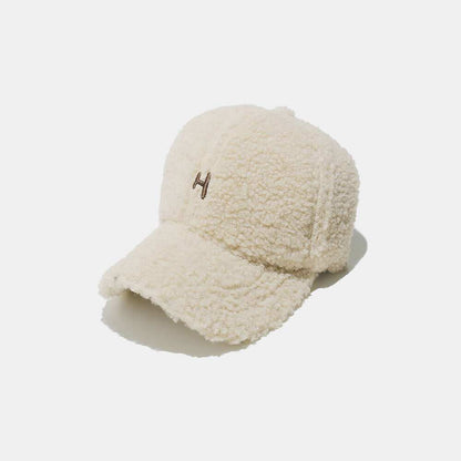 Sherpa Letter H Embroidered Cap with beige fluffy texture and letter H design.