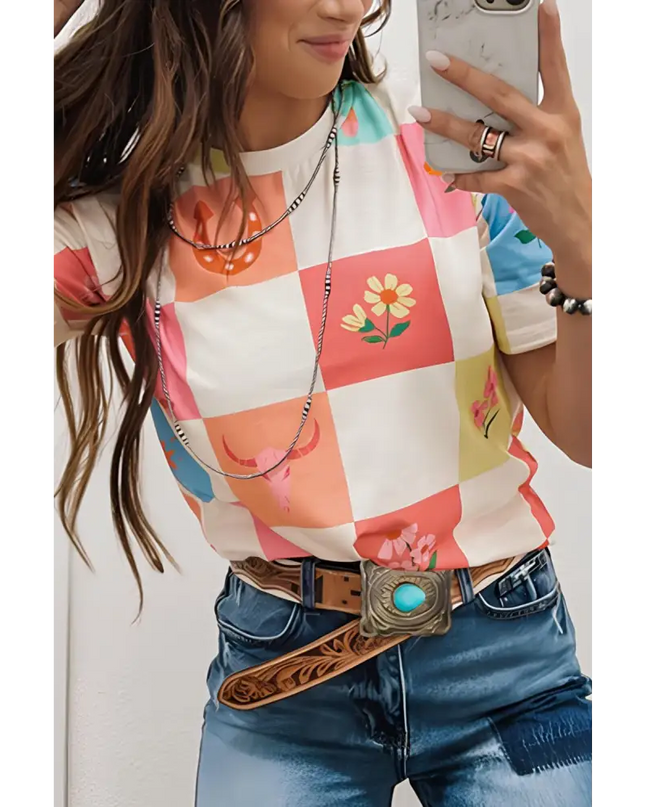 Woman in a checkered floral shirt and turquoise belt buckle, showcasing a round neck short sleeve t-shirt