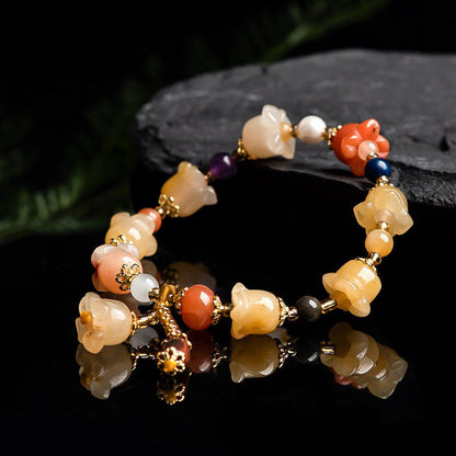 Natural Xinjiang Gold Silk Magnolia BraceletIntroducing our Natural Xinjiang Gold Silk Magnolia Bracelet, made with authentic Jinsi Jade from the Xinjiang province. This exquisite ethnic style bracelet featureBracletPlush Fashions ShopPlush Fashion Shop