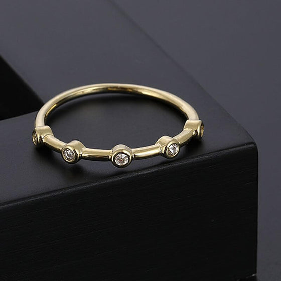 Minimalist gold ring with zirconium diamonds, electroplated with 14K gold, featuring a star shape design.