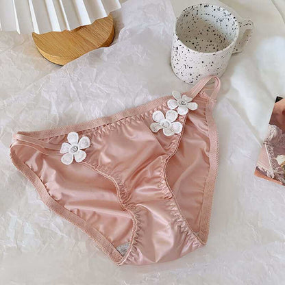 Silky embroidered floral low waist briefs for women on display.