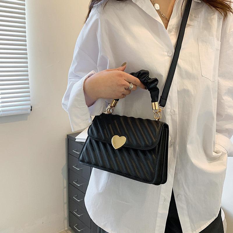 Women Handbags Fashion Chain Shoulder Bags With Love Metal DesignElevate your fashion game with our women handbags featuring a stylish chain and love metal design. Made with high-quality PU material, this small square bag is availHandbagsPlush Fashions ShopPlush Fashion Shop