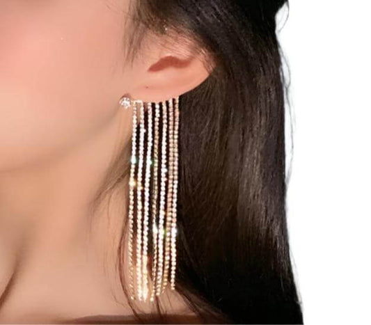 Simple long tassel earrings with geometric design in gold-plated finish.