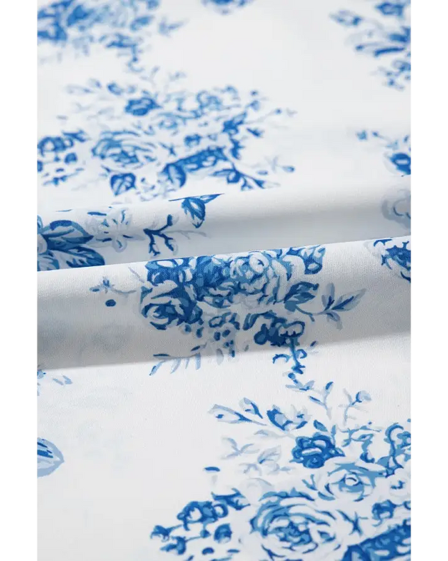 White fabric with blue floral pattern on a Floral Maxi Skirt with Split design