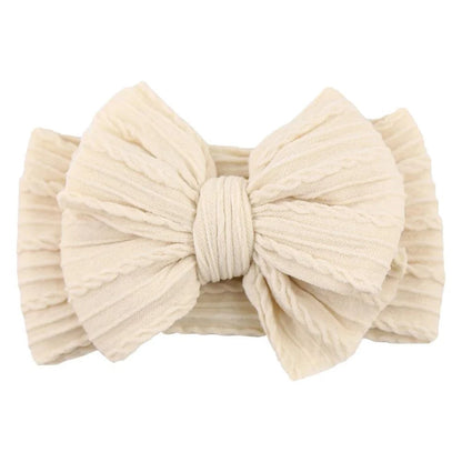 Newborn Solid Cable Baby Bow Headband for ChildEnhance any outfit with our Solid Cable Bow Baby Headband! Stretchy, soft Nylon material won't hurt your baby's head and will grow with them. Available in 20 colors,HairbowsPlush Fashions ShopPlush Fashion ShopNewborn Solid Cable Baby Bow Headband