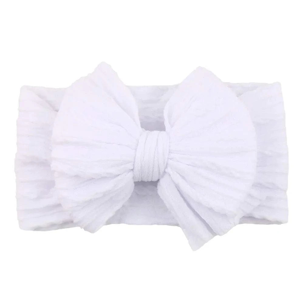 Newborn Solid Cable Baby Bow Headband for ChildEnhance any outfit with our Solid Cable Bow Baby Headband! Stretchy, soft Nylon material won't hurt your baby's head and will grow with them. Available in 20 colors,HairbowsPlush Fashions ShopPlush Fashion ShopNewborn Solid Cable Baby Bow Headband